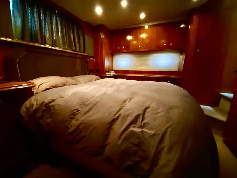 Slide: The Image of Luxurious bedroom interior of 2005 Cruisers Yachts 405 Express Motoryacht with wood finishes. - 33