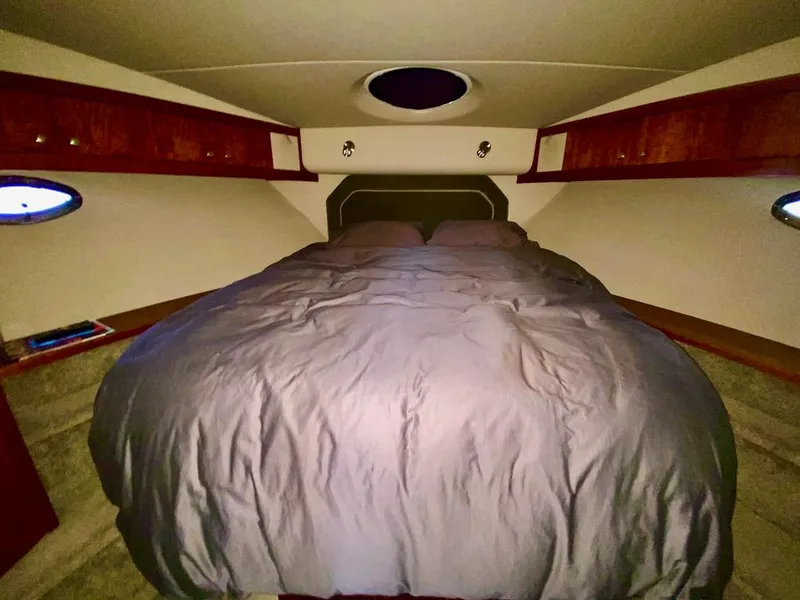 Slide: The Image of Luxurious bedroom in 2005 Cruisers Yachts 405 Express Motoryacht with cozy bedding. - 37