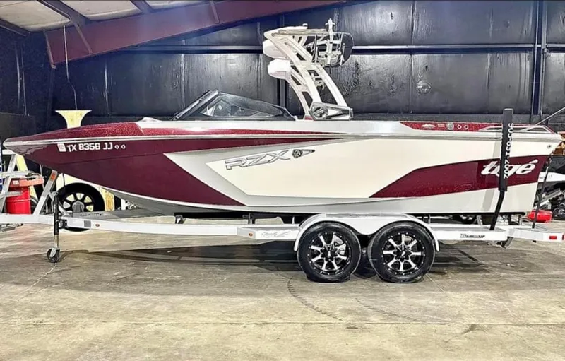 The Image of 2020 Tigé 22RZX boat on trailer in indoor storage facility. - 0
