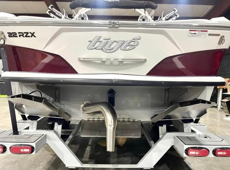 Slide: The Image of 2020 Tigé 22RZX boat rear view in a garage setting. - 3