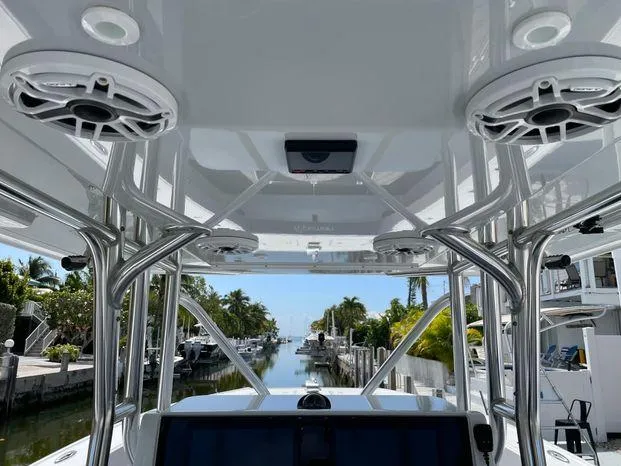 Slide: The Image of Interior view of a 2020 Freeman 34VH boat with sleek design and waterfront background. - 17
