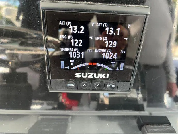 Slide: The Image of Suzuki engine display on Freeman 34VH, showing altimeter, engine temperature, and hours. - 18