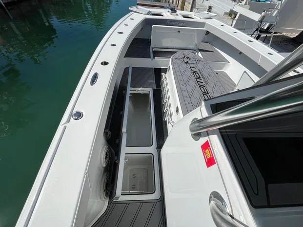 Slide: The Image of Freeman 34VH 2020 boat interior with open storage compartments and sleek design. - 19