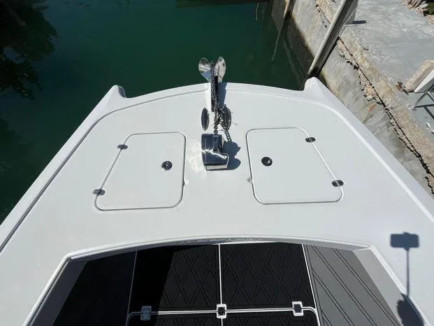 Slide: The Image of Bow of 2020 Freeman 34VH boat with anchor and storage hatches. - 23