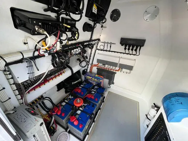 Slide: The Image of Electrical system inside a 2020 Freeman 34VH boat, featuring batteries and wiring. - 28