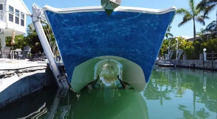 Slide: The Image of Freeman 34VH 2020 boat docked in a serene canal setting. - 3