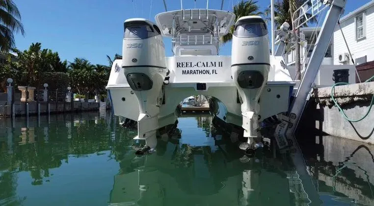 Slide: The Image of Freeman 34VH 2020 boat docked in Marathon, FL, with twin outboard engines. - 8