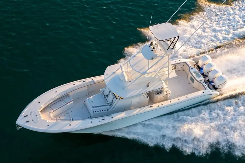 Slide: The Image of 2021 Yellowfin 42 boat cruising on water, aerial view. - 11