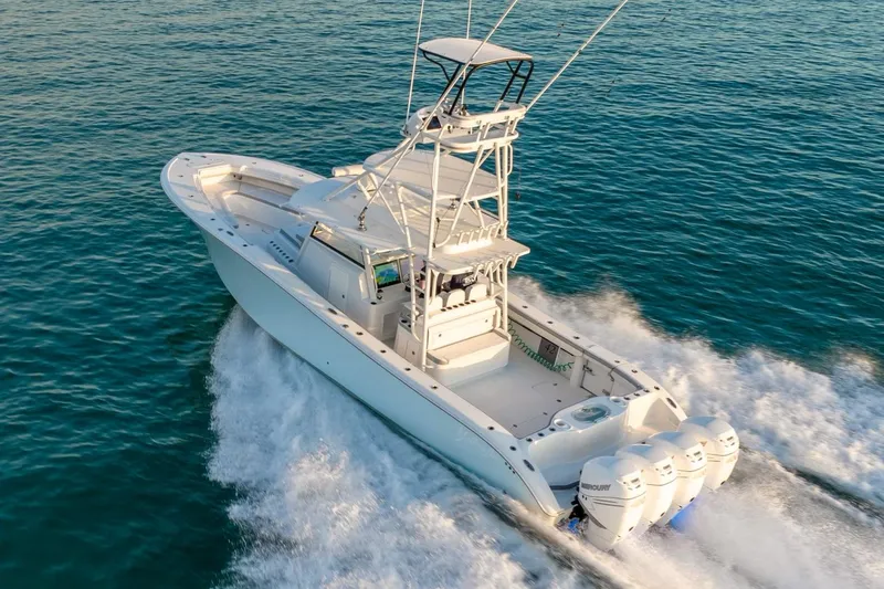 Slide: The Image of 2021 Yellowfin 42 boat cruising on open water with powerful engines. - 15