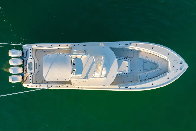 Slide: The Image of Aerial view of 2021 Yellowfin 42 boat on green water. - 18