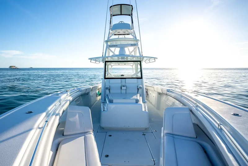 Slide: The Image of 2021 Yellowfin 42 boat on open water at sunrise. - 19