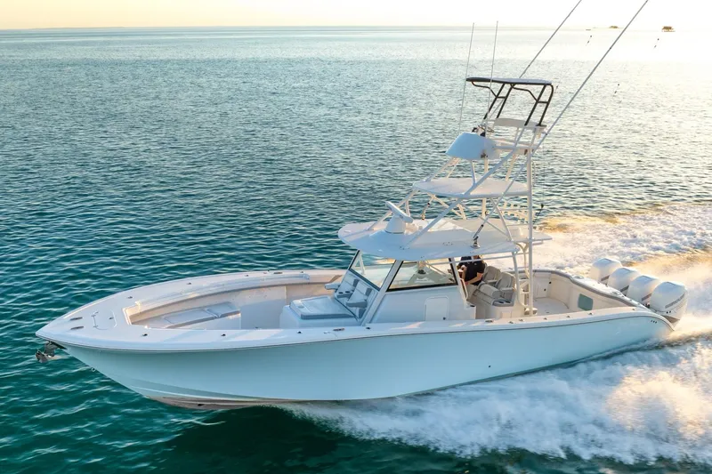 Slide: The Image of 2021 Yellowfin 42 boat cruising on open water, showcasing sleek design and powerful performance. - 2