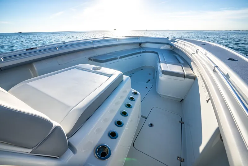 Slide: The Image of 2021 Yellowfin 42 boat interior with seating, ocean view, and sunny sky. - 22