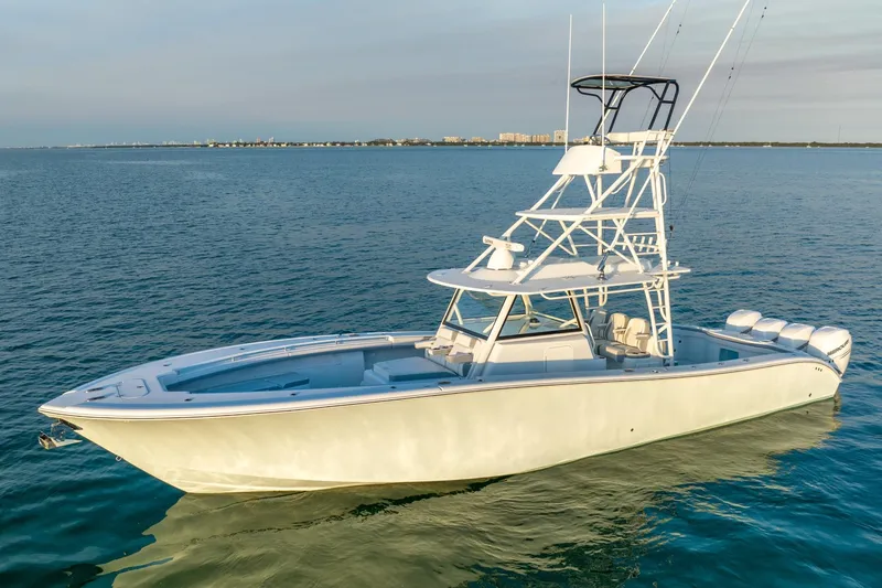 Slide: The Image of 2021 Yellowfin 42 boat on calm ocean waters. - 3
