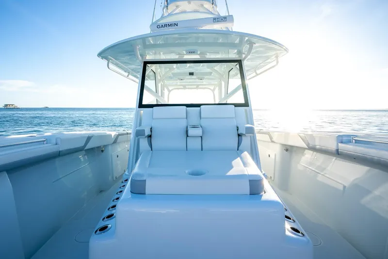 Slide: The Image of 2021 Yellowfin 42 boat on open water, showcasing sleek design and spacious deck. - 32