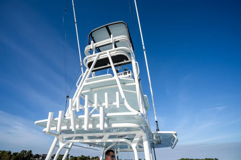 Slide: The Image of Yellowfin 42 boat tower against clear blue sky, 2021 model. - 34