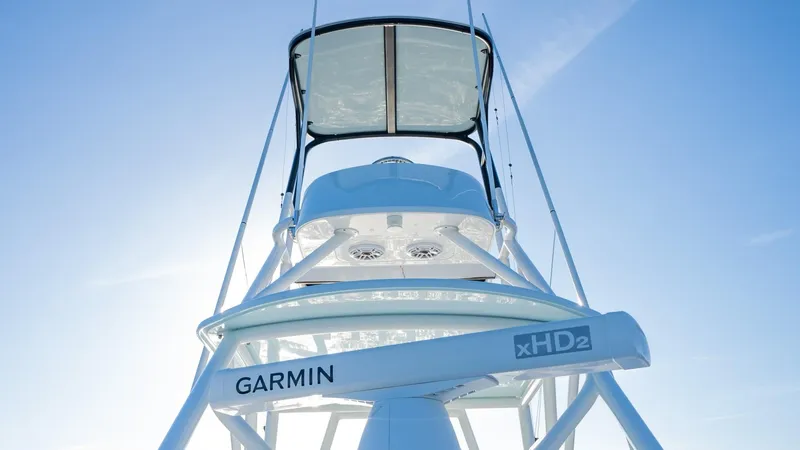 Slide: The Image of Yellowfin 42 boat with Garmin xHD2 radar, 2021 model, viewed from below against blue sky. - 35