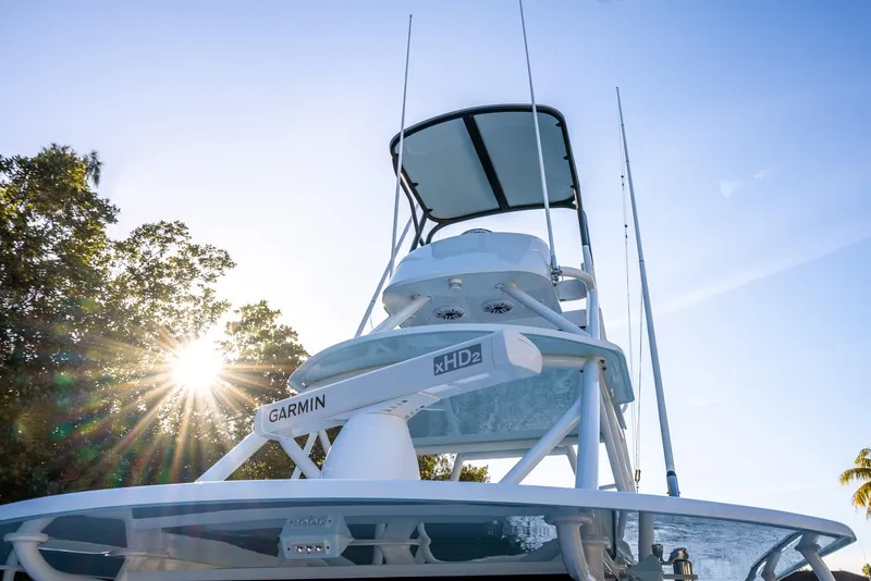 Slide: The Image of 2021 Yellowfin 42 boat with Garmin equipment, sunlit against a clear sky. - 36