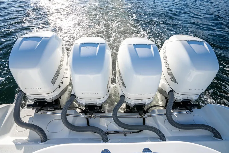 Slide: The Image of 2021 Yellowfin 42 boat with four powerful Mercury outboard engines on water. - 38