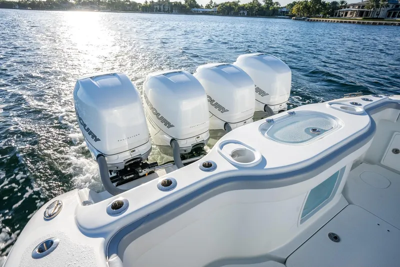 Slide: The Image of 2021 Yellowfin 42 boat with four powerful outboard engines on a sunny day. - 39