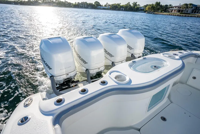Slide: The Image of 2021 Yellowfin 42 boat with four powerful outboard engines on a sunny day. - 41