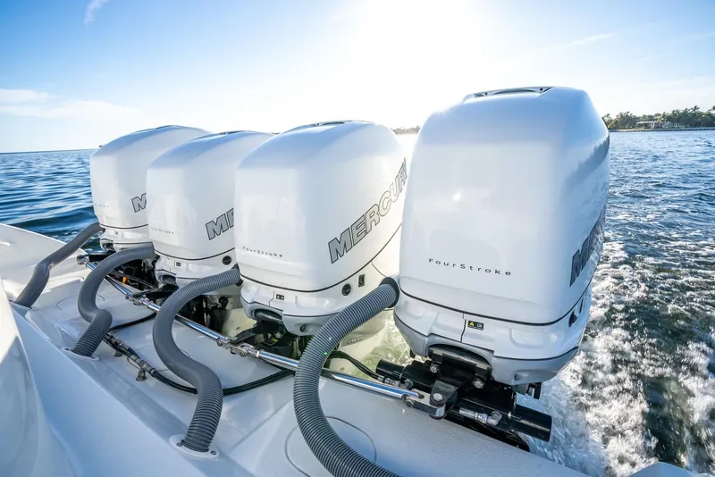 Slide: The Image of 2021 Yellowfin 42 boat with four powerful Mercury outboard engines on the water. - 42