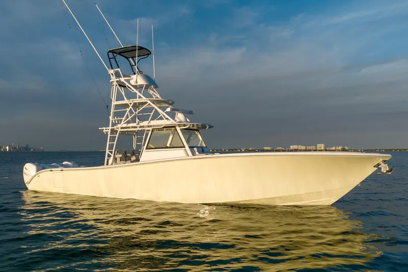 Slide: The Image of 2021 Yellowfin 42 boat on calm water at sunset. - 5