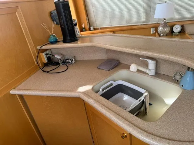 Slide: The Image of Kitchen area of 2000 McKinna 57 Pilothouse with sink and countertop. - 10