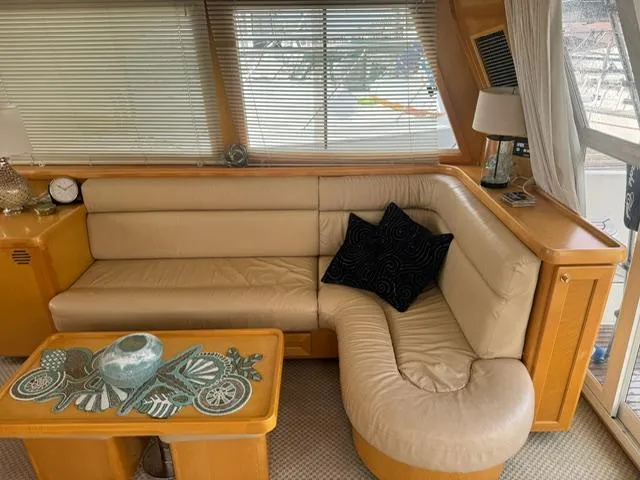 Slide: The Image of Luxurious interior of 2000 McKinna 57 Pilothouse with beige leather seating and decorative accents. - 15