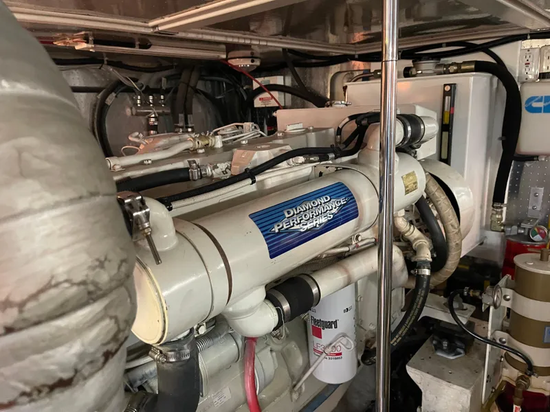 Slide: The Image of Engine room of a 2000 McKinna 57 Pilothouse yacht, featuring a Diamond Performance engine. - 2