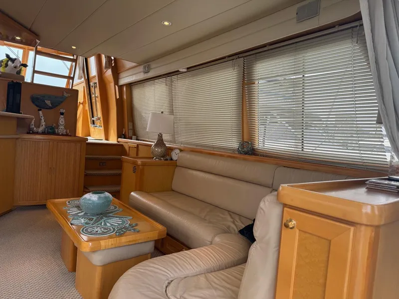 Slide: The Image of Luxurious interior of 2000 McKinna 57 Pilothouse yacht with beige leather seating. - 27