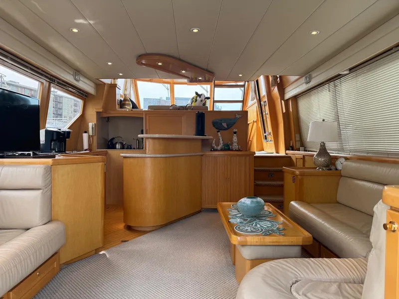 Slide: The Image of Luxurious interior of 2000 McKinna 57 Pilothouse yacht with elegant wood finishes. - 30
