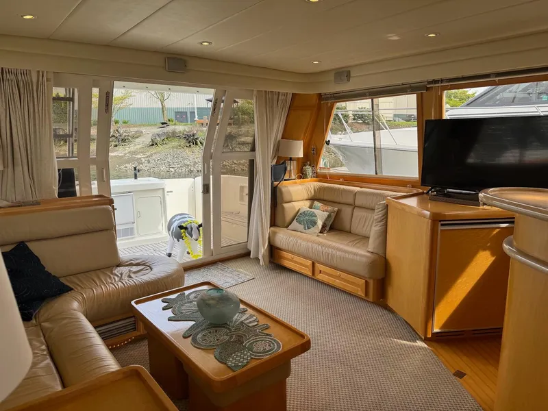 Slide: The Image of Luxurious 2000 McKinna 57 Pilothouse interior with leather seating and large windows. - 31