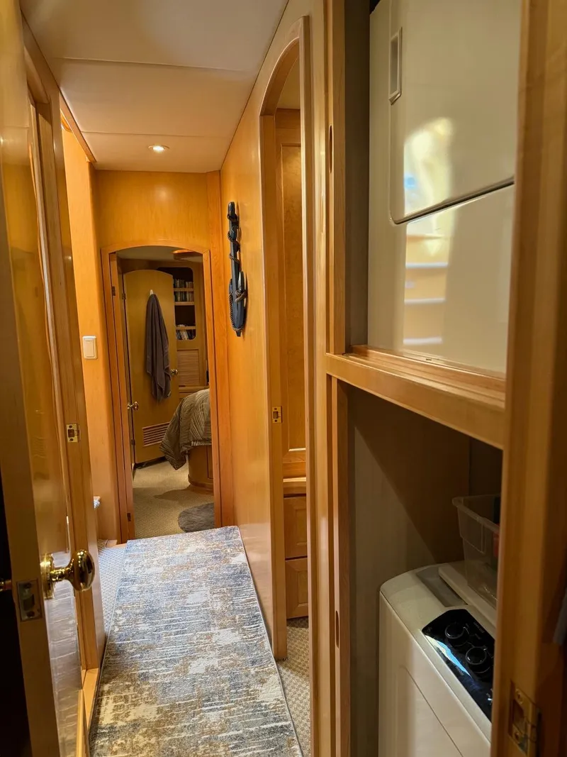 Slide: The Image of Interior hallway of 2000 McKinna 57 Pilothouse yacht with laundry area. - 33