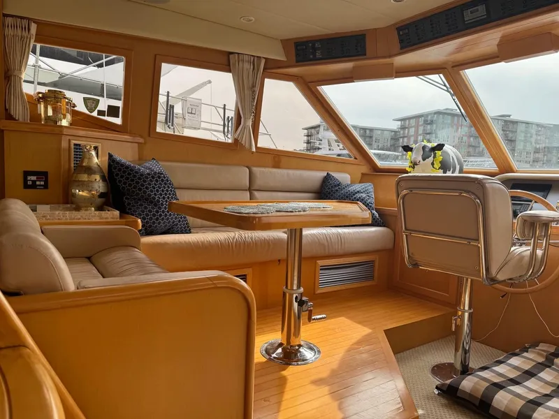 Slide: The Image of Luxurious 2000 McKinna 57 Pilothouse interior with plush seating and panoramic windows. - 34