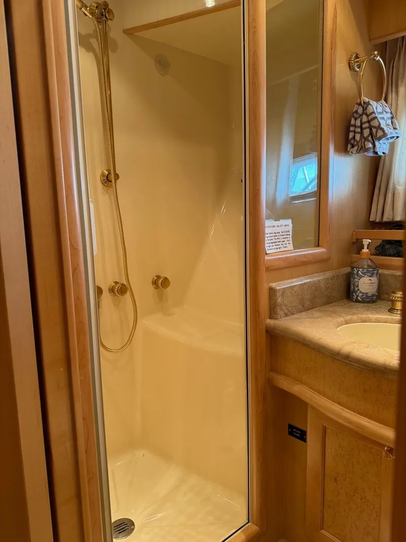 Slide: The Image of Luxurious bathroom in 2000 McKinna 57 Pilothouse yacht with shower and vanity. - 35