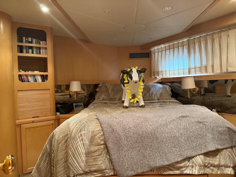 Slide: The Image of Luxurious bedroom in 2000 McKinna 57 Pilothouse yacht with plush cow decor. - 38