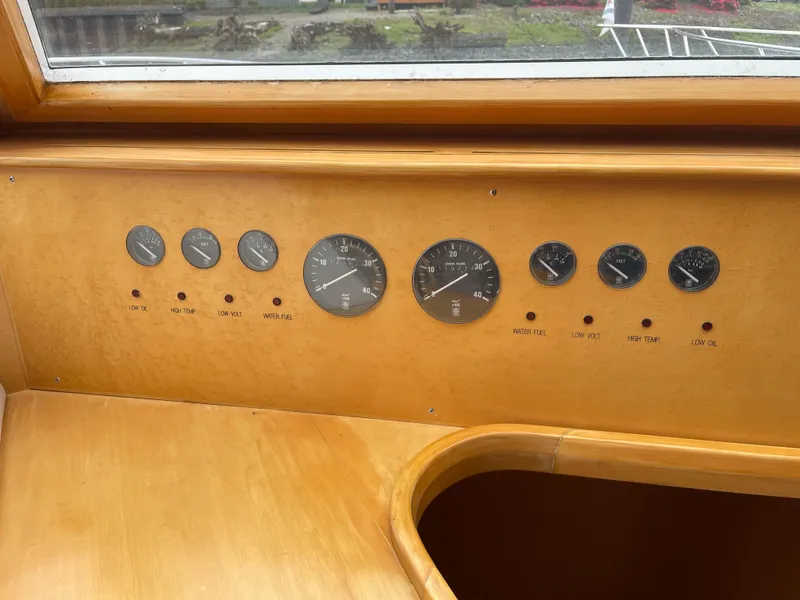 Slide: The Image of Control panel of a 2000 McKinna 57 Pilothouse yacht with gauges and indicators. - 48