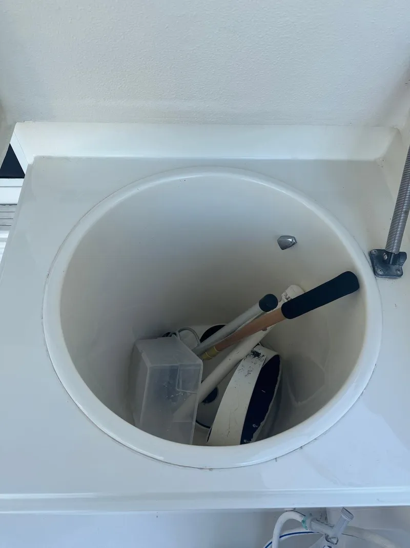 Slide: The Image of Fishing gear storage on 1989 Bertram 50 Convertible boat. - 12