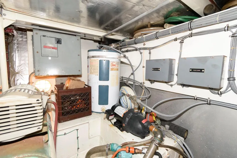 Slide: The Image of Engine room of 1989 Bertram 50 Convertible with electrical panels and equipment. - 29