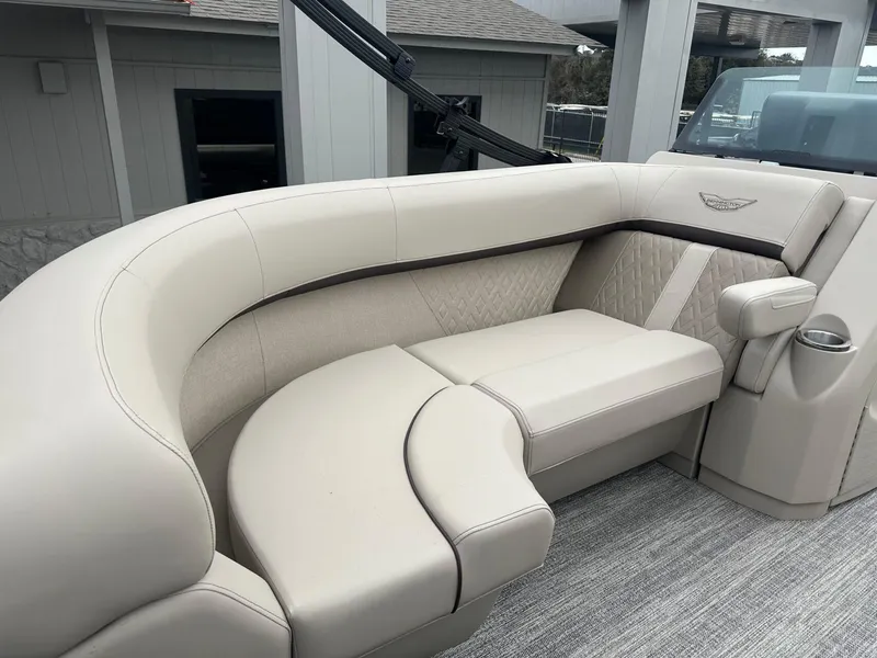 Slide: The Image of Luxurious seating on a 2025 Bennington 22MFB boat, featuring elegant beige upholstery. - 12