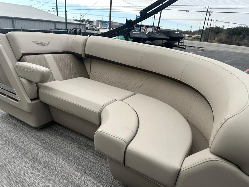 Slide: The Image of Luxurious seating on 2025 Bennington 22MFB boat, featuring elegant beige upholstery and modern design. - 13