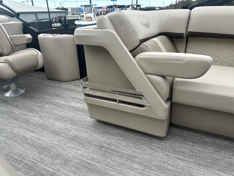 Slide: The Image of 2025 Bennington 22MFB boat interior with luxurious beige seating and modern design. - 17