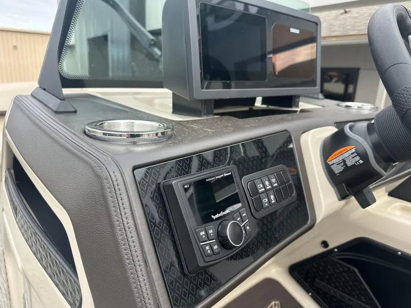 Slide: The Image of 2025 Bennington 22MFB boat dashboard with modern controls and display. - 23