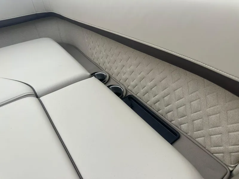 Slide: The Image of Luxurious seating with cup holders in 2025 Bennington 22MFB boat interior. - 27