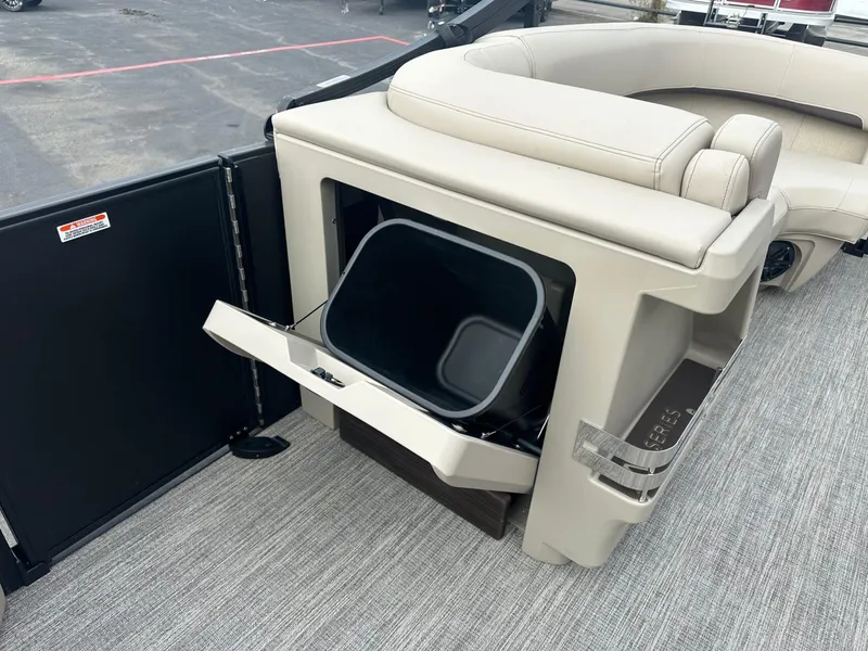 Slide: The Image of 2025 Bennington 22MFB boat interior with storage compartment and seating. - 30
