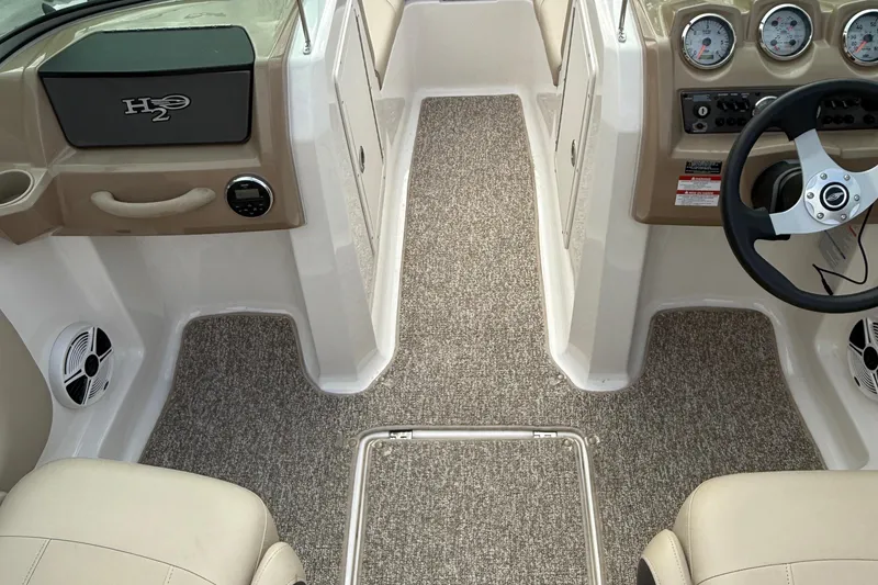 Slide: The Image of 2014 Chaparral 18 Ski & Fish H2O boat interior with steering wheel and dashboard. - 15
