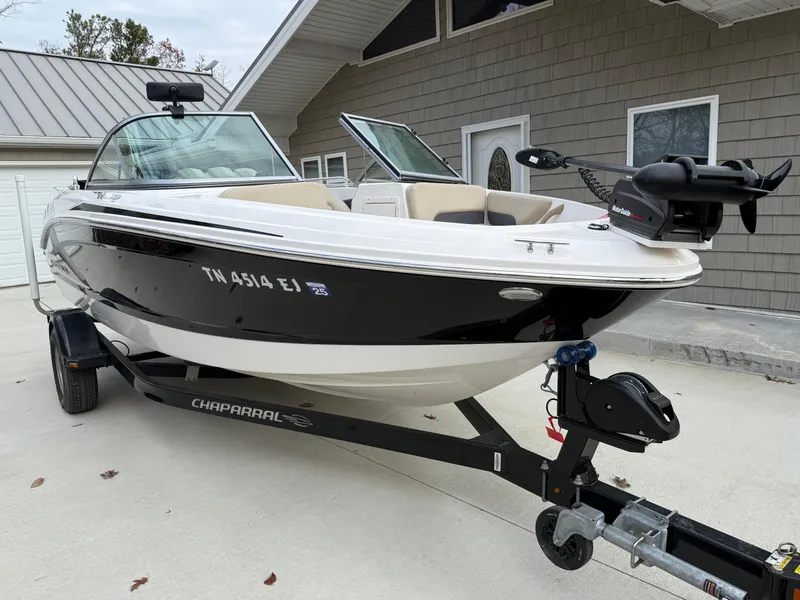 Slide: The Image of 2014 Chaparral 18 Ski & Fish H2O boat on trailer, parked near a house. - 5