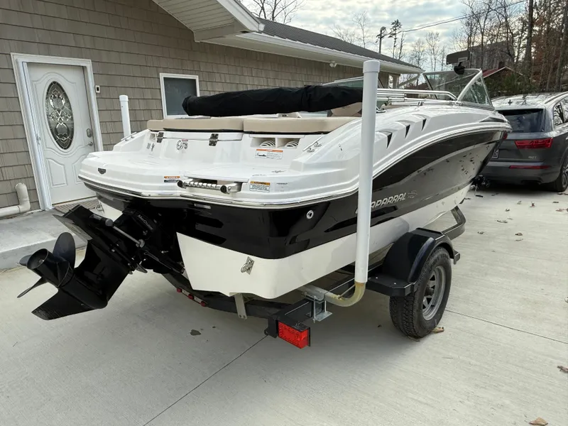 Slide: The Image of 2014 Chaparral 18 Ski & Fish H2O boat on trailer, parked in driveway. - 8