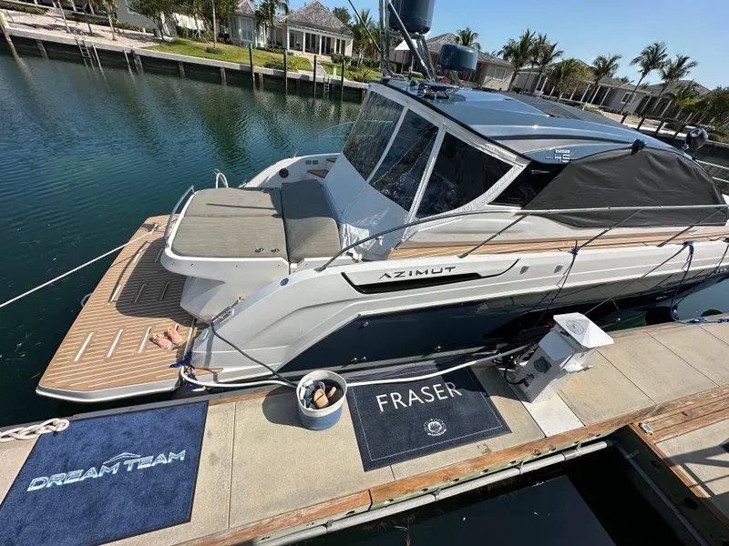 Slide: The Image of Azimut Atlantis 45 yacht docked at marina, 2021 model, with "Dream Team" and "Fraser" mats. - 11